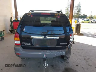 2002 Mazda Tribute LX with VIN 4F2CU08172KM58561, listed as a IAAI auction lot 41435407 with 141,908 mi miles and . Bid and sale history available at carsss.com. Image 16.