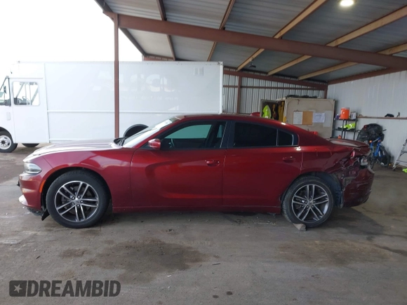 2019 Dodge Charger SXT with VIN 2C3CDXJG0KH757909, listed as a IAAI auction lot 41597907 with 71,882 mi miles and . Bid and sale history available at DreamBid. Image 14.