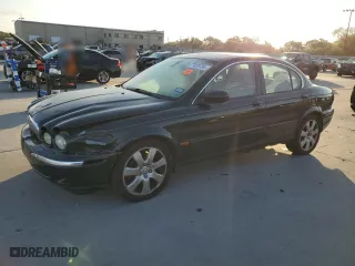 2004 Jaguar X-Type with VIN SAJEA51C24WE14915, listed as a Copart auction lot 77828734 with 0 mi miles and Salvage Title. Bid and sale history available at carsss.com. Image 1.