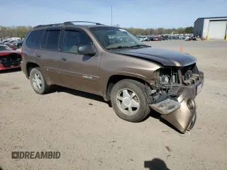 2003 GMC Envoy SLT z VIN 1GKDS13S032134647, wystawiony jako Copart lot #50137325 z przebiegiem 217 878 mil mil oraz Szkody całkowita. Historia ofert i sprzedaży dostępna na DreamBid. Obrazek 4.