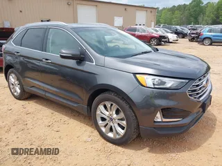 2020 Ford Edge Titanium z VIN 2FMPK4K98LBA76737, wystawiony jako IAAI lot #41981689 z przebiegiem 93 501 mil mil oraz . Historia ofert i sprzedaży dostępna na DreamBid. Obrazek 1.