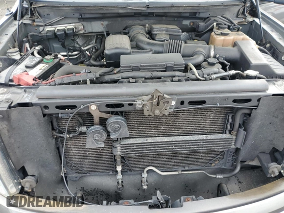 2010 Ford F-150 XL with VIN 1FTFW1EV1AFD48049, listed as a Copart auction lot 58571135 with 189,439 mi miles and Salvage title. Bid and sale history available at DreamBid. Image 11.