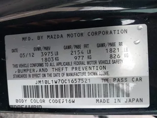 2012 Mazda 3 i Grand Touring with VIN JM1BL1W70C1657521, listed as a IAAI auction lot 41994605 with 165,912 mi miles and . Bid and sale history available at DreamBid. Image 9.