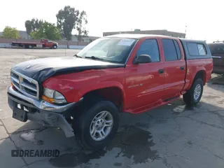 2001 Dodge Dakota Sport with VIN 1B7GG2AN51S148828, listed as a IAAI auction lot 42095653 with 232,995 mi miles and . Bid and sale history available at carsss.com. Image 2.