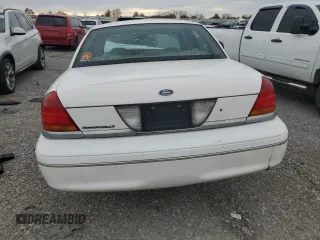 2000 Ford Crown Victoria LX z VIN 2FAFP74W4YX120352, wystawiony jako Copart lot #79833264 z przebiegiem Nie podano mil oraz Szkoda całkowita • Salvage title. Historia ofert i sprzedaży dostępna na DreamBid. Obrazek 6.