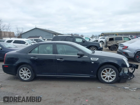 2009 Cadillac STS AWD z VIN 1G6DD67V290140111, wystawiony jako IAAI lot #41800236 z przebiegiem 81 913 mil mil oraz . Historia ofert i sprzedaży dostępna na DreamBid. Obrazek 12.