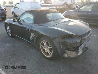 2005 Porsche Boxster z VIN WP0CA29885U711749, wystawiony jako Copart lot #84301684 z przebiegiem 272 856 mil mil oraz Szkoda całkowita • Salvage title. Historia ofert i sprzedaży dostępna na DreamBid. Obrazek 2.
