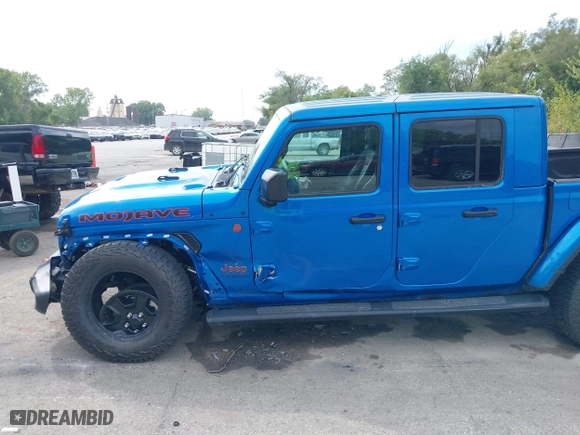 2023 Jeep Gladiator Mojave with VIN 1C6JJTEG0PL593061, listed as a IAAI auction lot 40287955 with 3,930 mi miles. Bid and sale history available at carsss.com. Image 6.