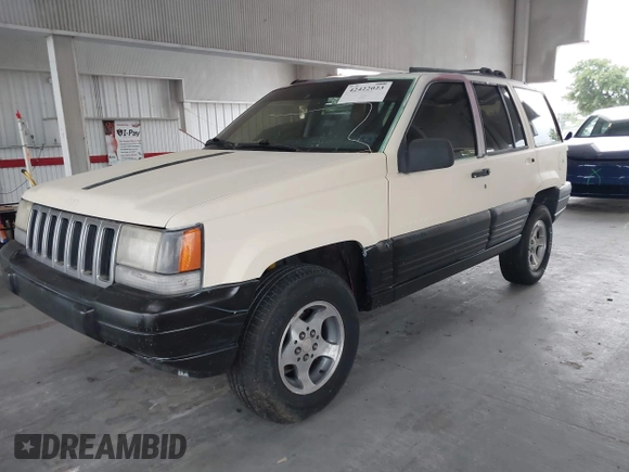 1996 Jeep Grand Cherokee Laredo z VIN 1J4FX58S7TC157272, wystawiony jako IAAI lot #42422023 z przebiegiem 229 170 mil mil oraz . Historia ofert i sprzedaży dostępna na DreamBid. Obrazek 2.