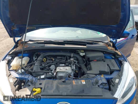 2018 Ford Focus SE z VIN 1FADP3FE1JL254632, wystawiony jako IAAI lot #42408683 z przebiegiem 74 696 mil mil oraz . Historia ofert i sprzedaży dostępna na DreamBid. Obrazek 10.