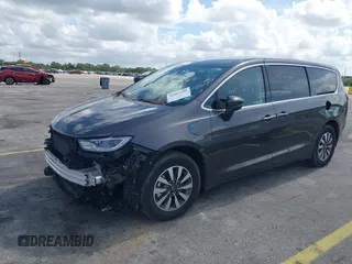 2023 Chrysler Pacifica Hybrid Touring L with VIN 2C4RC1L74PR579782, listed as a IAAI auction lot 42487390 with Not provided miles and . Bid and sale history available at DreamBid. Image 19.