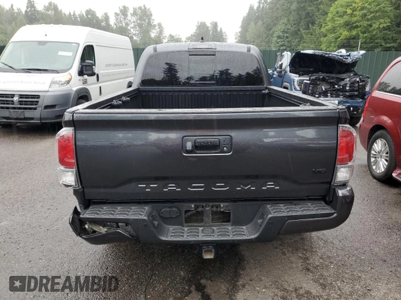 2020 Toyota Tacoma SR5 with VIN 3TMDZ5BN2LM097782, listed as a Copart auction lot 61573465 with 57,321 mi miles and Salvage title. Bid and sale history available at DreamBid. Image 6.