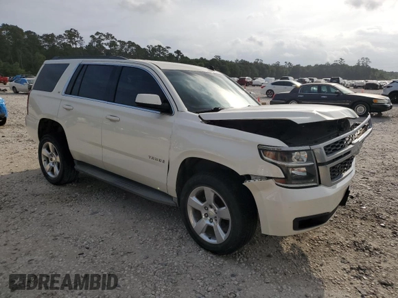 2015 Chevrolet Tahoe LT with VIN 1GNSCBKC9FR220574, listed as a Copart auction lot 54788555 with 244,491 mi miles and Salvage title. Bid and sale history available at DreamBid. Image 4.
