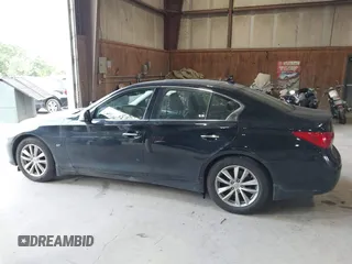 2015 Infiniti Q50 Premium z VIN JN1BV7AR9FM423471, wystawiony jako IAAI lot #42641857 z przebiegiem 86 919 mil mil oraz . Historia ofert i sprzedaży dostępna na DreamBid. Obrazek 14.