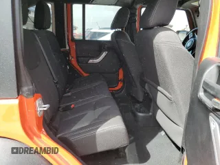 2015 Jeep Wrangler Unlimited Rubicon with VIN 1C4BJWFG9FL654550, listed as a Copart auction lot 49306965 with 64,911 mi miles and Salvage Title. Bid and sale history available at carsss.com. Image 10.