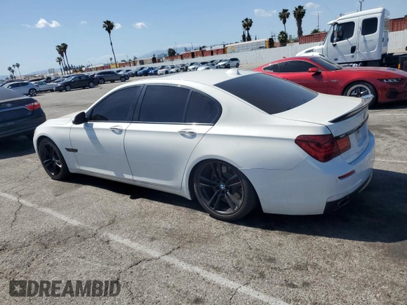 2013 BMW 7 Series 750i with VIN WBAYA8C54DC996412, listed as a Copart auction lot 56982895 with 124,258 mi miles and Salvage title. Bid and sale history available at DreamBid. Image 2.