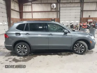 2022 Volkswagen Tiguan S z VIN 3VV0B7AX2NM042934, wystawiony jako IAAI lot #42172199 z przebiegiem 71 367 mil mil oraz . Historia ofert i sprzedaży dostępna na DreamBid. Obrazek 13.