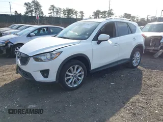 2014 Mazda CX-5 Grand Touring with VIN JM3KE4DY7E0425201, listed as a IAAI auction lot 41803597 with 118,867 mi miles. Bid and sale history available at carsss.com. Image 2.