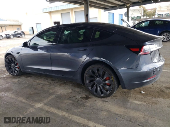 2021 Tesla Model 3 Performance with VIN 5YJ3E1EC1MF074350, listed as a Copart auction lot 47434275 with 63,319 mi miles and Salvage Title. Bid and sale history available at DreamBid. Image 2.