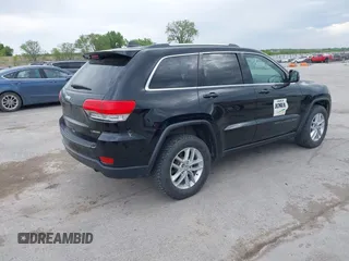 2018 Jeep Grand Cherokee Laredo E with VIN 1C4RJFAG6JC335606, listed as a IAAI auction lot 42280666 with 113,438 mi miles and . Bid and sale history available at DreamBid. Image 4.