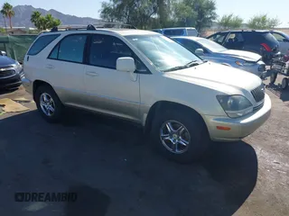 1999 Lexus RX 300 z VIN JT6GF10U2X0011802, wystawiony jako IAAI lot #42393239 z przebiegiem 152 558 mil mil oraz . Historia ofert i sprzedaży dostępna na DreamBid. Obrazek 1.
