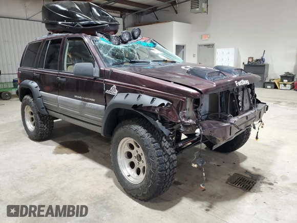 1996 Jeep Grand Cherokee Laredo with VIN 1J4GZ58Y1TC171915, listed as a Copart auction lot 50764034 with 0 mi miles and Salvage Title. Bid and sale history available at carsss.com. Image 4.