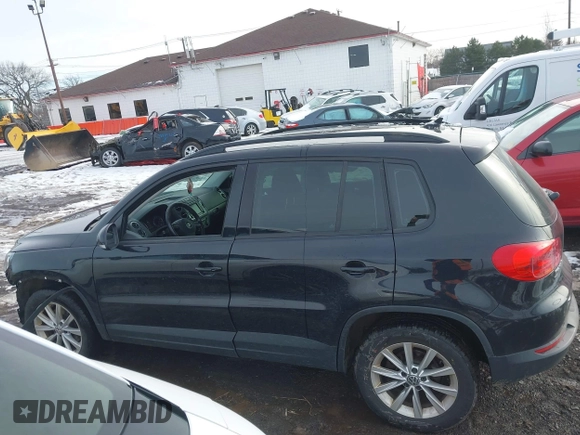 2017 Volkswagen Tiguan S with VIN WVGBV7AX7HK047973, listed as a IAAI auction lot 41197329 with 92,960 mi miles and . Bid and sale history available at DreamBid. Image 14.