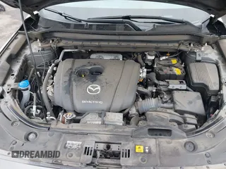 2020 Mazda CX-5 Grand Touring with VIN JM3KFBDM4L0829861, listed as a IAAI auction lot 41826250 with 62,091 mi miles and . Bid and sale history available at carsss.com. Image 10.