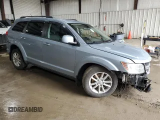 2013 Dodge Journey SXT with VIN 3C4PDDBG8DT579154, listed as a Copart auction lot 51261135 with 96,230 mi miles and Salvage Title. Bid and sale history available at DreamBid. Image 4.