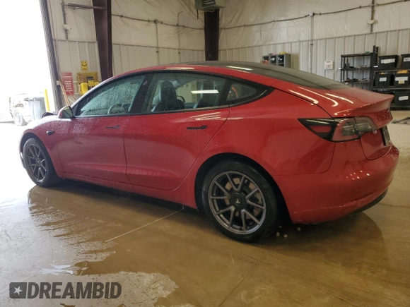 2022 Tesla Model 3 Long Range with VIN 5YJ3E1EBXNF285779, listed as a Copart auction lot 54630135 with 129,097 mi miles and Clean Title. Bid and sale history available at DreamBid. Image 2.