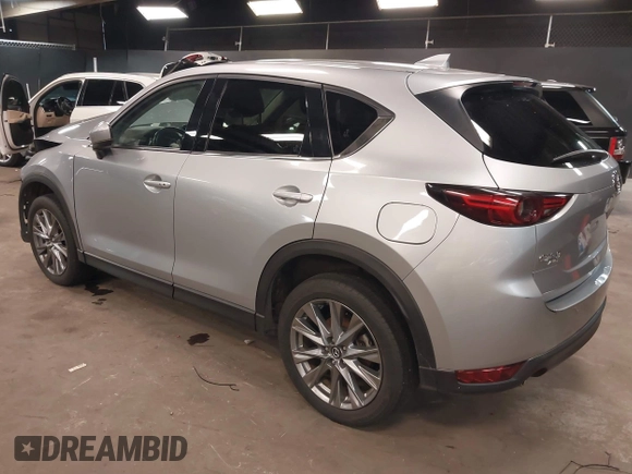 2021 Mazda CX-5 Grand Touring with VIN JM3KFBDM7M1392644, listed as a IAAI auction lot 41824612 with 80,000 mi miles and . Bid and sale history available at DreamBid. Image 3.