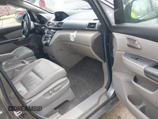 2012 Honda Odyssey Touring with VIN 5FNRL5H99CB028304, listed as a IAAI auction lot 42031916 with 216,185 mi miles and . Bid and sale history available at DreamBid. Image 5.