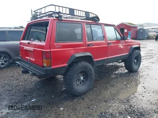 1996 Jeep Cherokee Sport with VIN 1J4FJ68S4TL244893, listed as a IAAI auction lot 41190369 with 192,459 mi miles and . Bid and sale history available at DreamBid. Image 4.