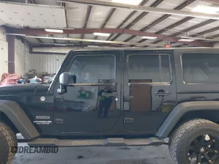 2012 Jeep Wrangler Unlimited Sport with VIN 1C4BJWDG8CL246829, listed as a IAAI auction lot 41816197 with 198,502 mi miles. Bid and sale history available at carsss.com. Image 15.