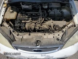 2007 Ford Focus S z VIN 1FAFP34NX7W106482, wystawiony jako Copart lot #57675245 z przebiegiem 170 237 mil mil oraz Szkoda całkowita • Salvage title. Historia ofert i sprzedaży dostępna na DreamBid. Obrazek 11.