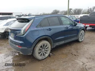 2022 Cadillac XT4 FWD Sport with VIN 1GYFZER44NF151862, listed as a IAAI auction lot 41429850 with 9,854 mi miles. Bid and sale history available at carsss.com. Image 4.