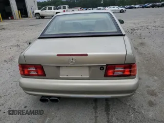 1999 Mercedes-Benz SL 500 z VIN WDBFA68F4XF184352, wystawiony jako Copart lot #57874355 z przebiegiem 215 118 mil mil oraz Tytuł czysty. Historia ofert i sprzedaży dostępna na DreamBid. Obrazek 6.