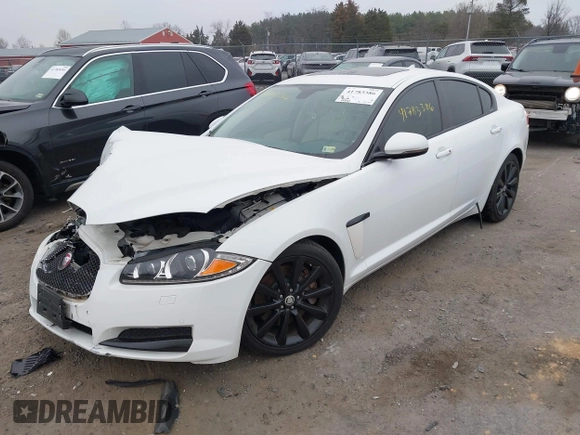 2014 Jaguar XF SC with VIN SAJWA0EX0E8U09381, listed as a IAAI auction lot 41783386 with 27,730 mi miles and . Bid and sale history available at DreamBid. Image 2.