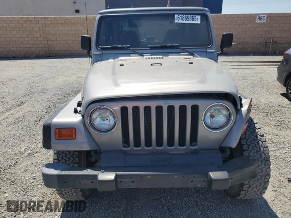 2000 Jeep Wrangler SE with VIN 1J4FA29P7YP737289, listed as a Copart auction lot 61869865 with 91,097 mi miles and Salvage title. Bid and sale history available at DreamBid. Image 5.