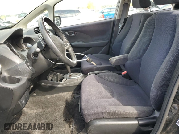 2012 Honda Fit Sport with VIN JHMGE8H58CC013885, listed as a Copart auction lot 53052205 with 144,182 mi miles and Salvage Title. Bid and sale history available at carsss.com. Image 7.
