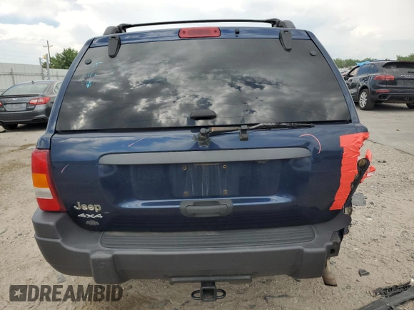 2004 Jeep Grand Cherokee Laredo with VIN 1J4GW48S04C125931, listed as a Copart auction lot 59972695 with 198,403 mi miles and Salvage title. Bid and sale history available at DreamBid. Image 6.