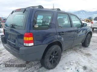 2003 Ford Escape XLS Popular with VIN 1FMYU92153KE01890, listed as a IAAI auction lot 41605087 with 109,411 mi miles. Bid and sale history available at carsss.com. Image 4.
