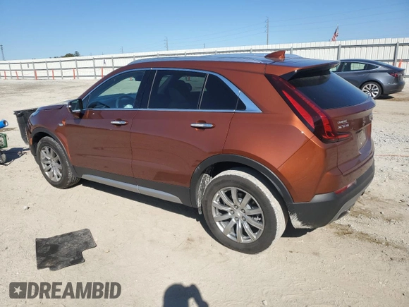 2021 Cadillac XT4 FWD Premium Luxury z VIN 1GYFZCR46MF076066, wystawiony jako Copart lot #47493235 z przebiegiem 21 550 mil mil oraz Nie do naprawy. Historia ofert i sprzedaży dostępna na DreamBid. Obrazek 2.