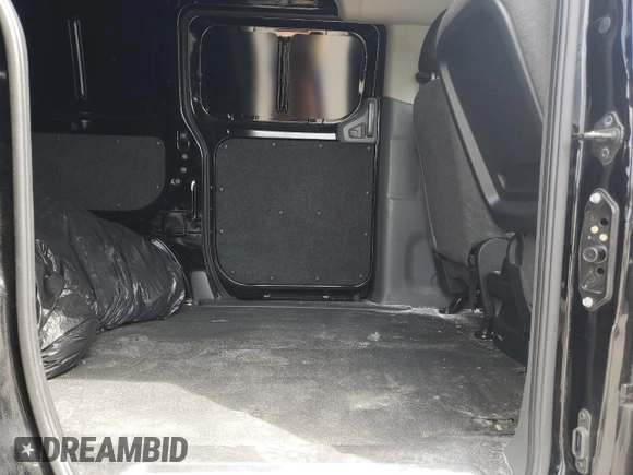 2021 Nissan NV200 SV with VIN 3N6CM0KN9MK695939, listed as a Copart auction lot 52696025 with 65,639 mi miles and Salvage title. Bid and sale history available at DreamBid. Image 11.