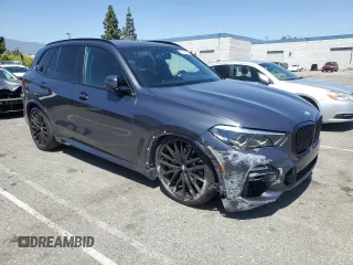 2021 BMW X5 xDrive40i with VIN 5UXCR6C06M9H65380, listed as a Copart auction lot 57445405 with 33,916 mi miles and Salvage title. Bid and sale history available at DreamBid. Image 4.