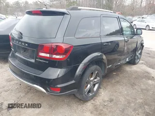 2015 Dodge Journey Crossroad with VIN 3C4PDCGG3FT599771, listed as a IAAI auction lot 41634296 with 76,547 mi miles and . Bid and sale history available at DreamBid. Image 4.