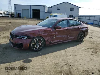 2022 BMW 5 Series M550i xDrive z VIN WBA13BK00NCJ93306, wystawiony jako Copart lot #42082574 z przebiegiem Nie podano mil oraz . Historia ofert i sprzedaży dostępna na DreamBid. Obrazek 1.