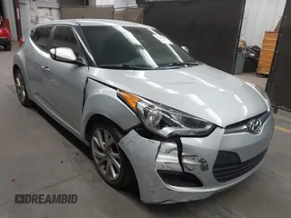 2016 Hyundai Veloster z VIN KMHTC6AD8GU299664, wystawiony jako IAAI lot #42162059 z przebiegiem 79 083 mil mil oraz . Historia ofert i sprzedaży dostępna na DreamBid. Obrazek 1.