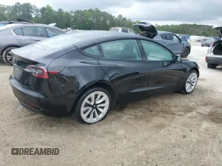 2022 Tesla Model 3 with VIN 5YJ3E1EA0NF372095, listed as a Copart auction lot 54958215 with 148,441 mi miles and Clean Title. Bid and sale history available at DreamBid. Image 3.
