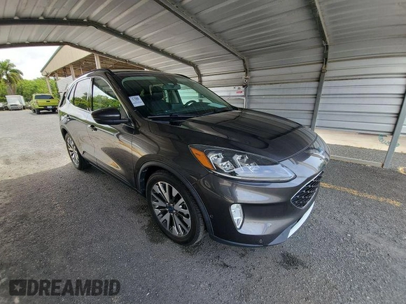 2020 Ford Escape Titanium Hybrid with VIN 1FMCU0DZ2LUB82013, listed as a IAAI auction lot 42727391 with 92,623 mi miles and . Bid and sale history available at DreamBid. Image 2.